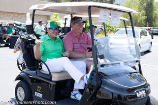 Golfers in a golf cart at a charity golf tournament  by Donna Coleman Photography