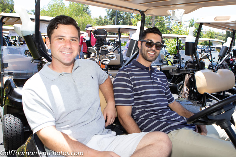 Golfers in golf cart at a golf tournament by Donna Coleman Photography in Tarzana
